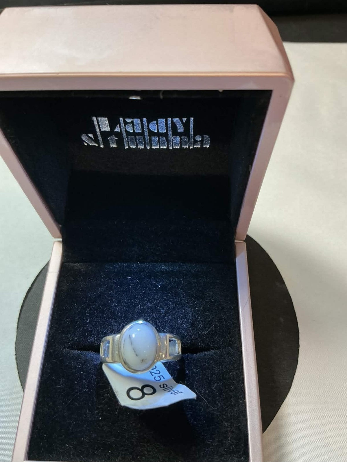 agate, in a crown or bezel setting.