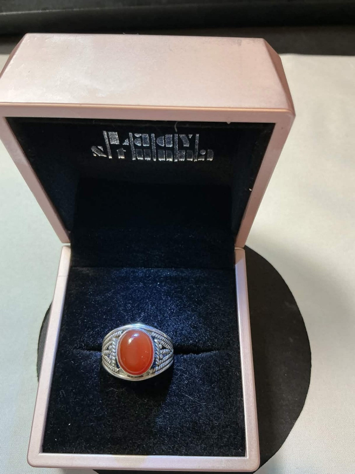 sterling silver men's ring featuring a natural red agate stone, often referred t