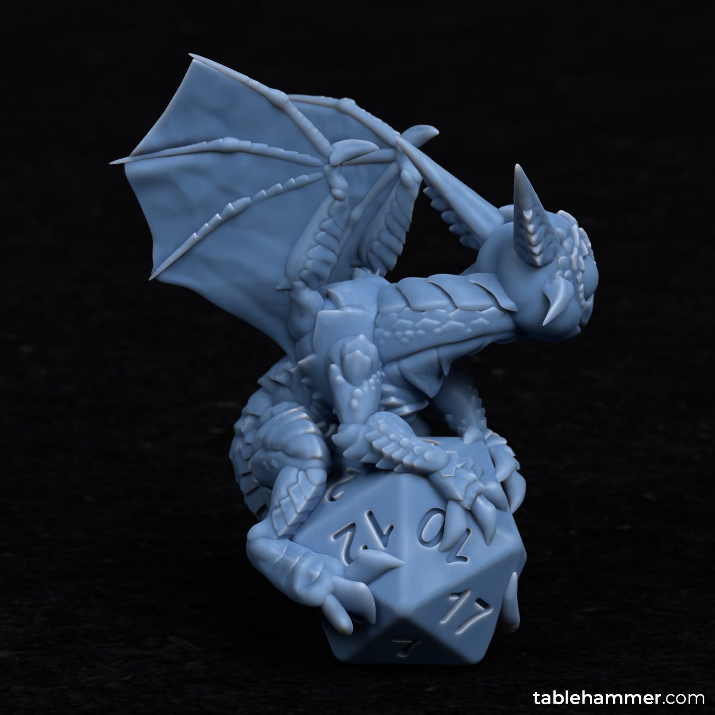 Unpainted Baby Dragon on top of dice image 1