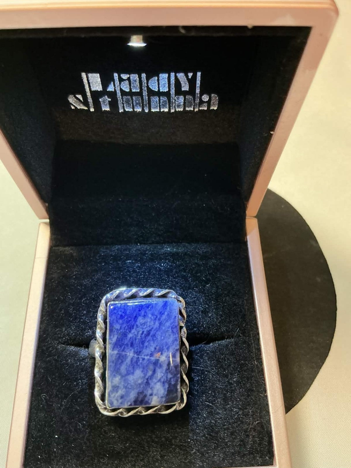 sterling silver ring features a rectangular lapis lazuli gemstone.