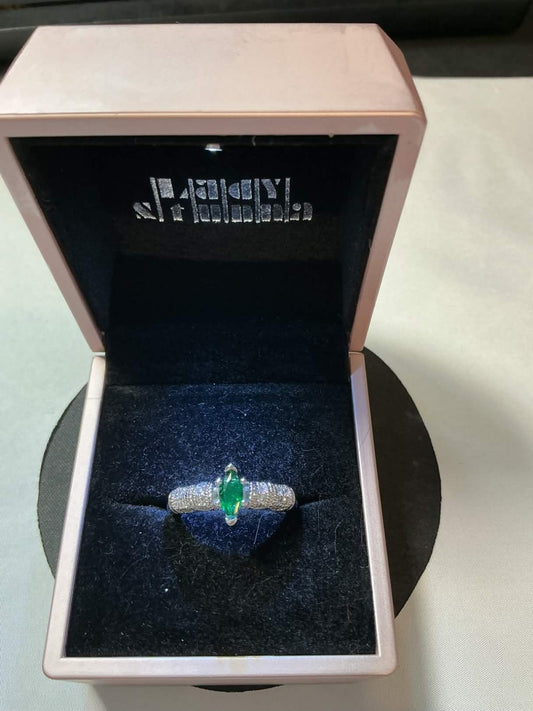 marquise-cut emerald surrounded by diamonds