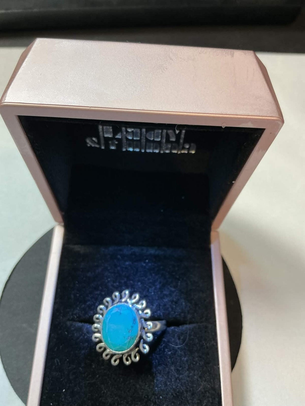 sterling silver turquoise ring featuring an oval-cut stone