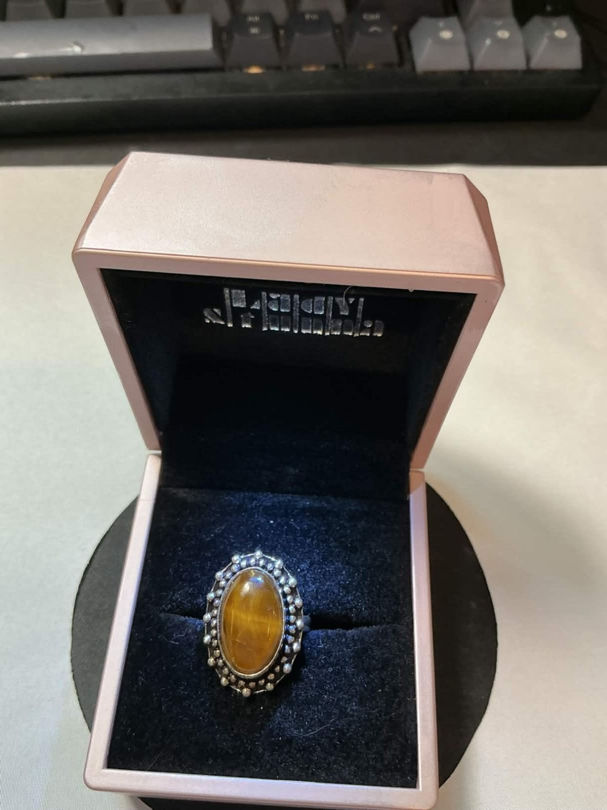 vintage sterling silver ring featuring a chatoyant tiger's eye gemstone in a bez