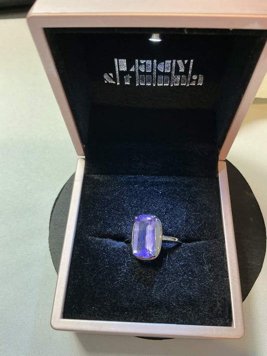 emerald-cut tanzanite gemstone set in white gold