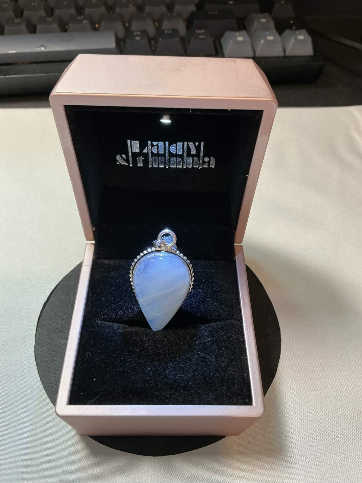 pear-shaped opalite pendant set in 925 sterling silver.