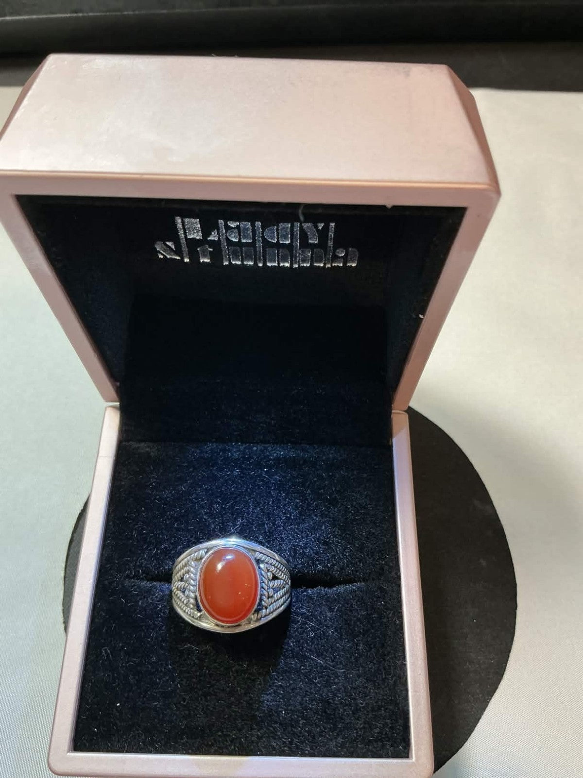 sterling silver men's ring featuring a natural red agate stone, often referred t