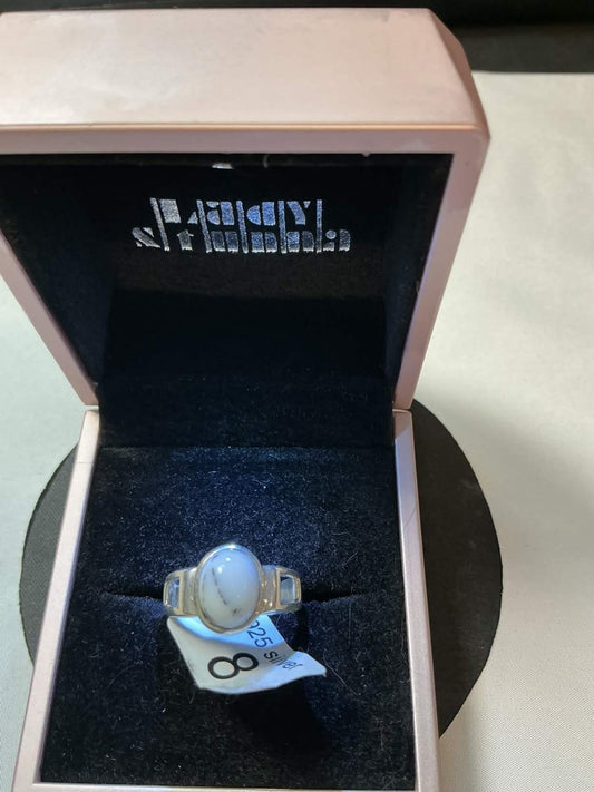 agate, in a crown or bezel setting.