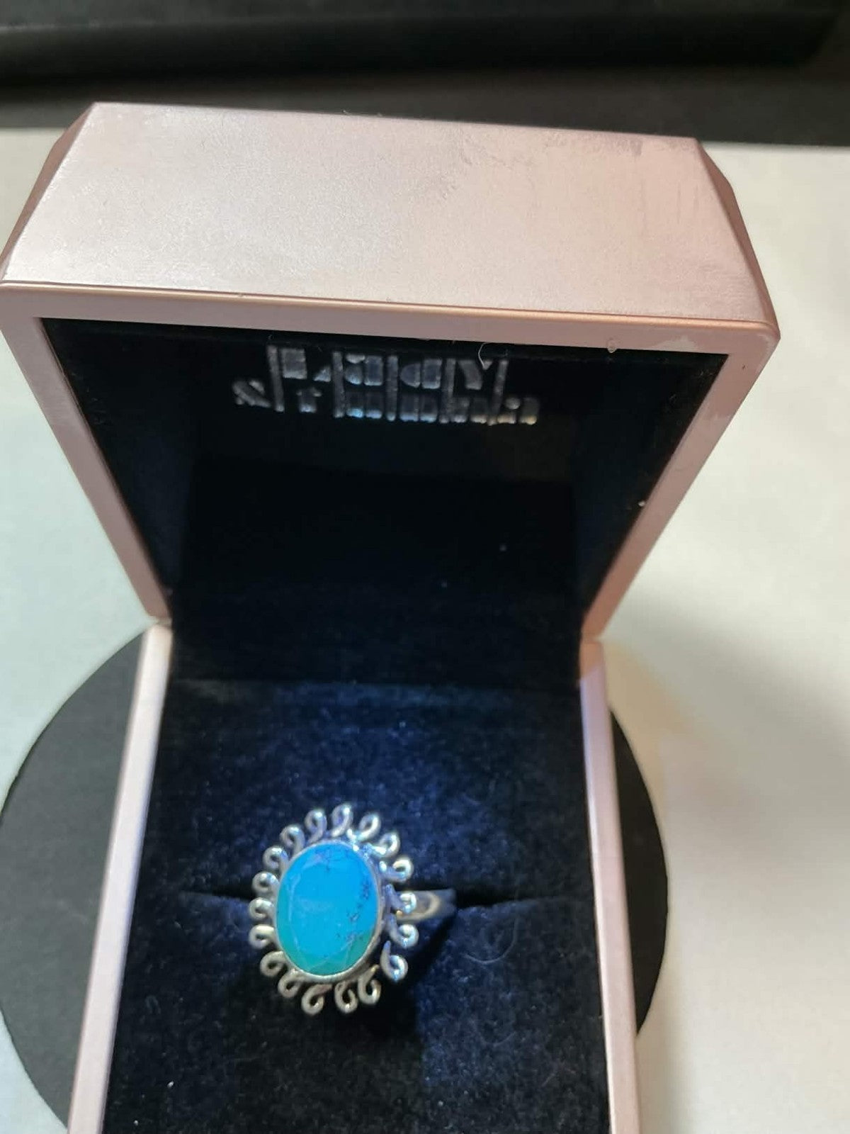 sterling silver turquoise ring featuring an oval-cut stone