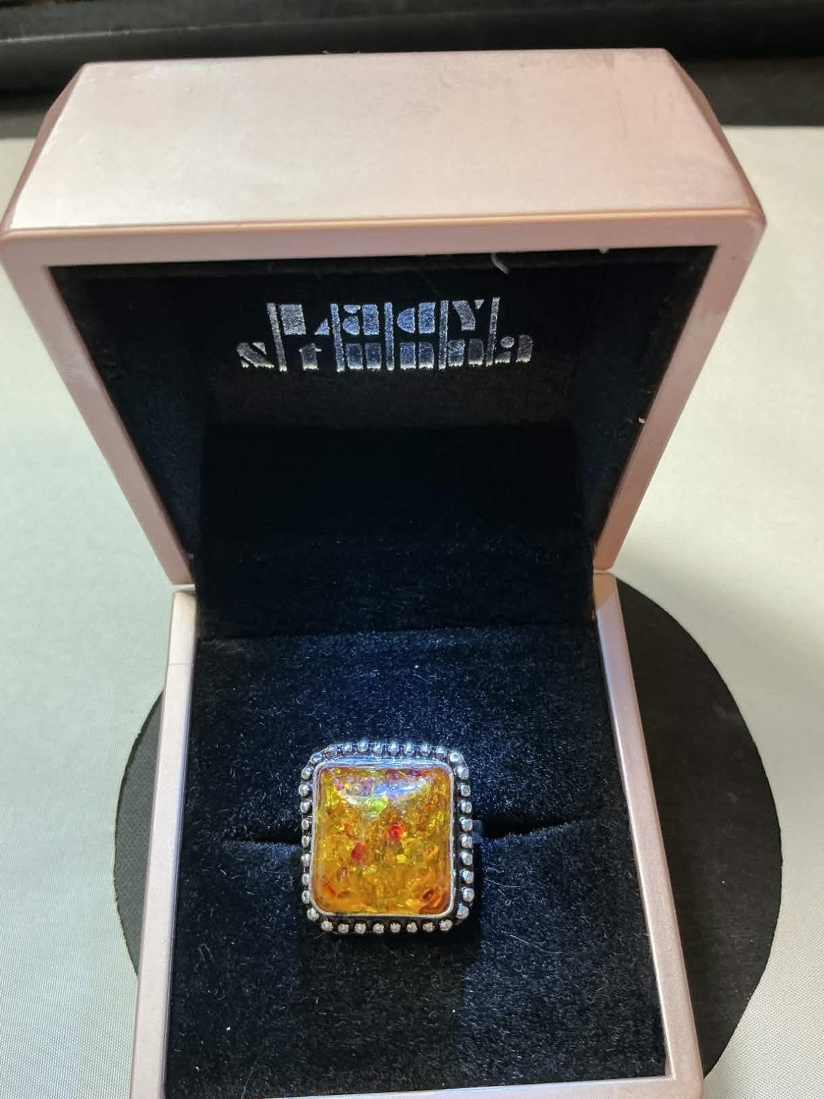 sterling silver amber ring, likely featuring a natural amber stone set in a 925