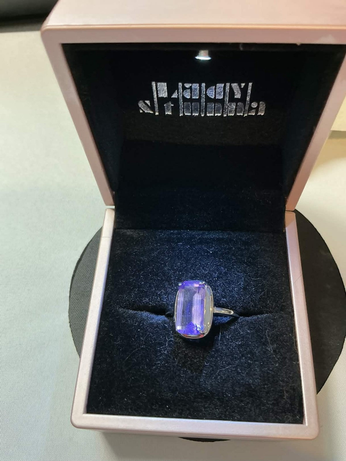 emerald-cut tanzanite gemstone set in white gold
