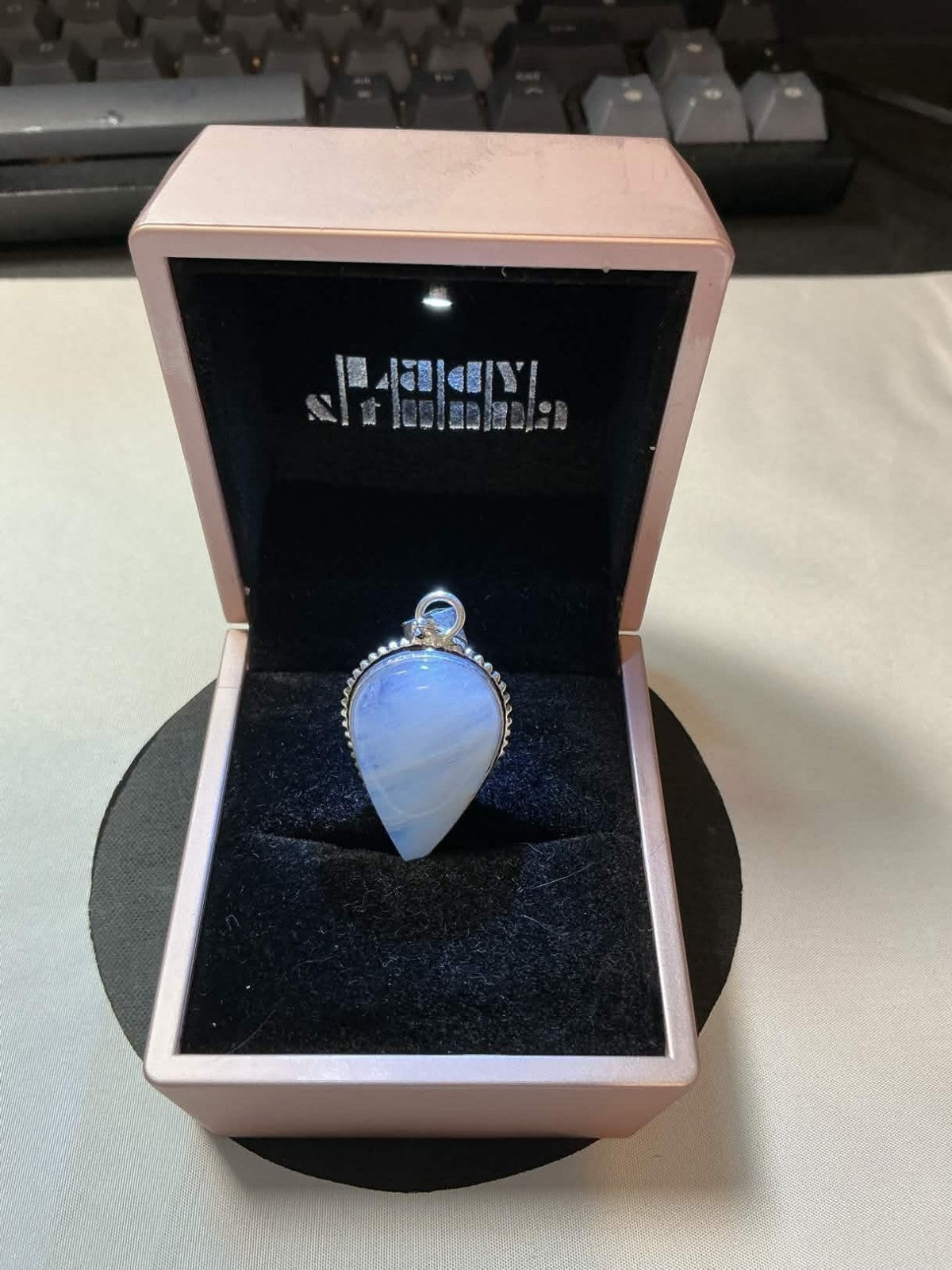 pear-shaped opalite pendant set in 925 sterling silver.