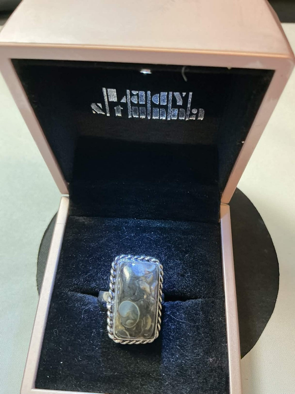 sterling silver ring features a rectangular dendritic agate stone, often referre