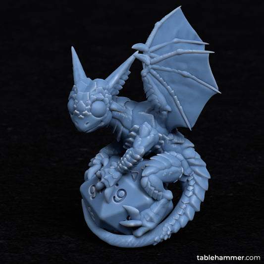 Unpainted Baby Dragon on top of dice image 0